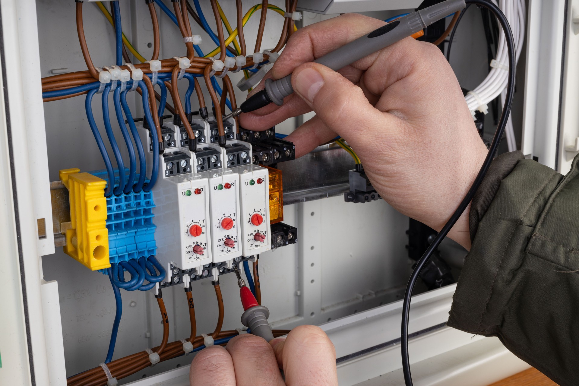 Electrician Working on Circuit Breaker Panel